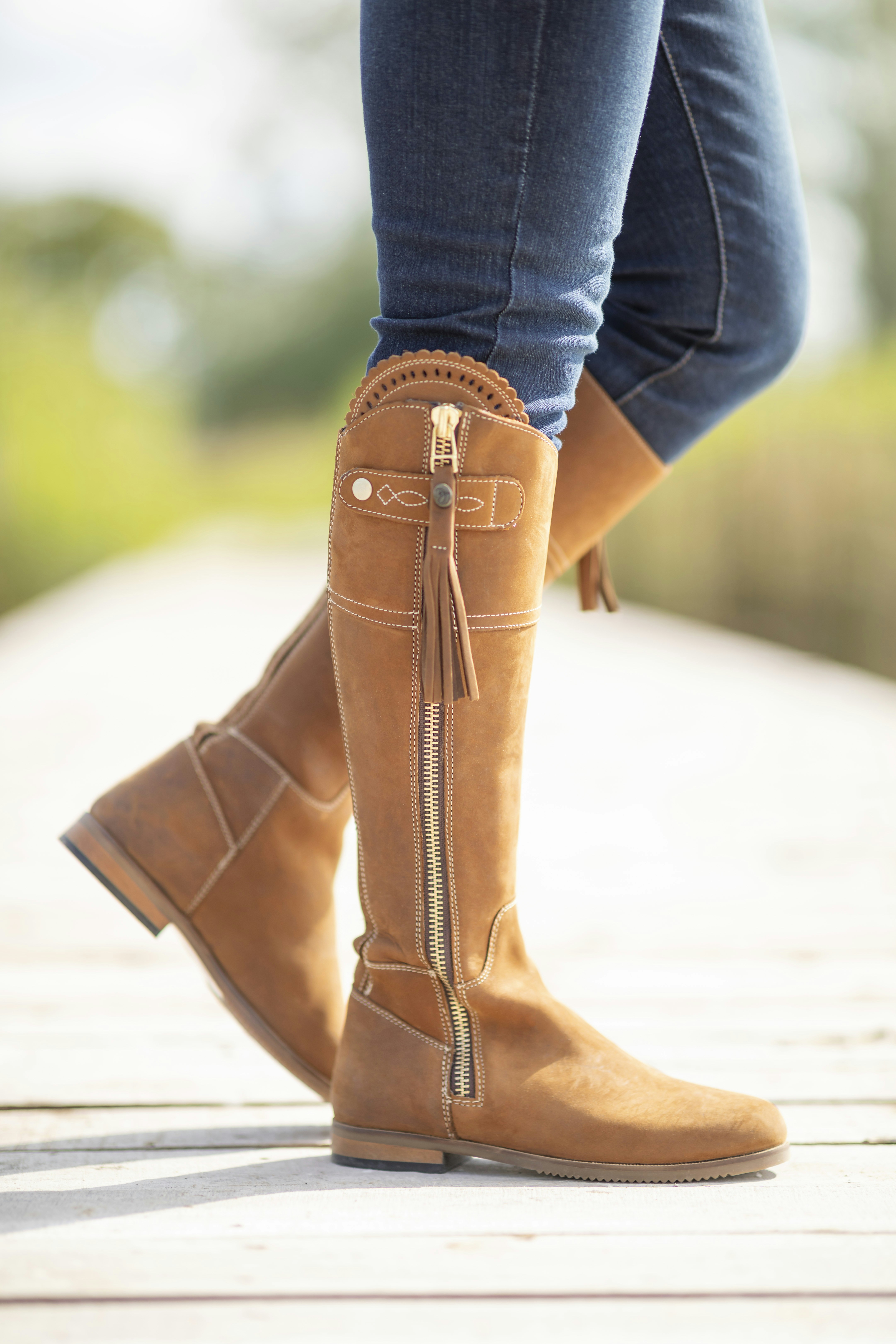 A close up of a person wearing boots