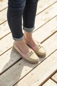 A woman standing on top of a wooden platform