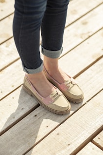 A woman standing on top of a wooden platform