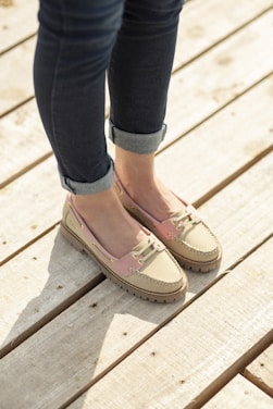 A woman standing on top of a wooden platform