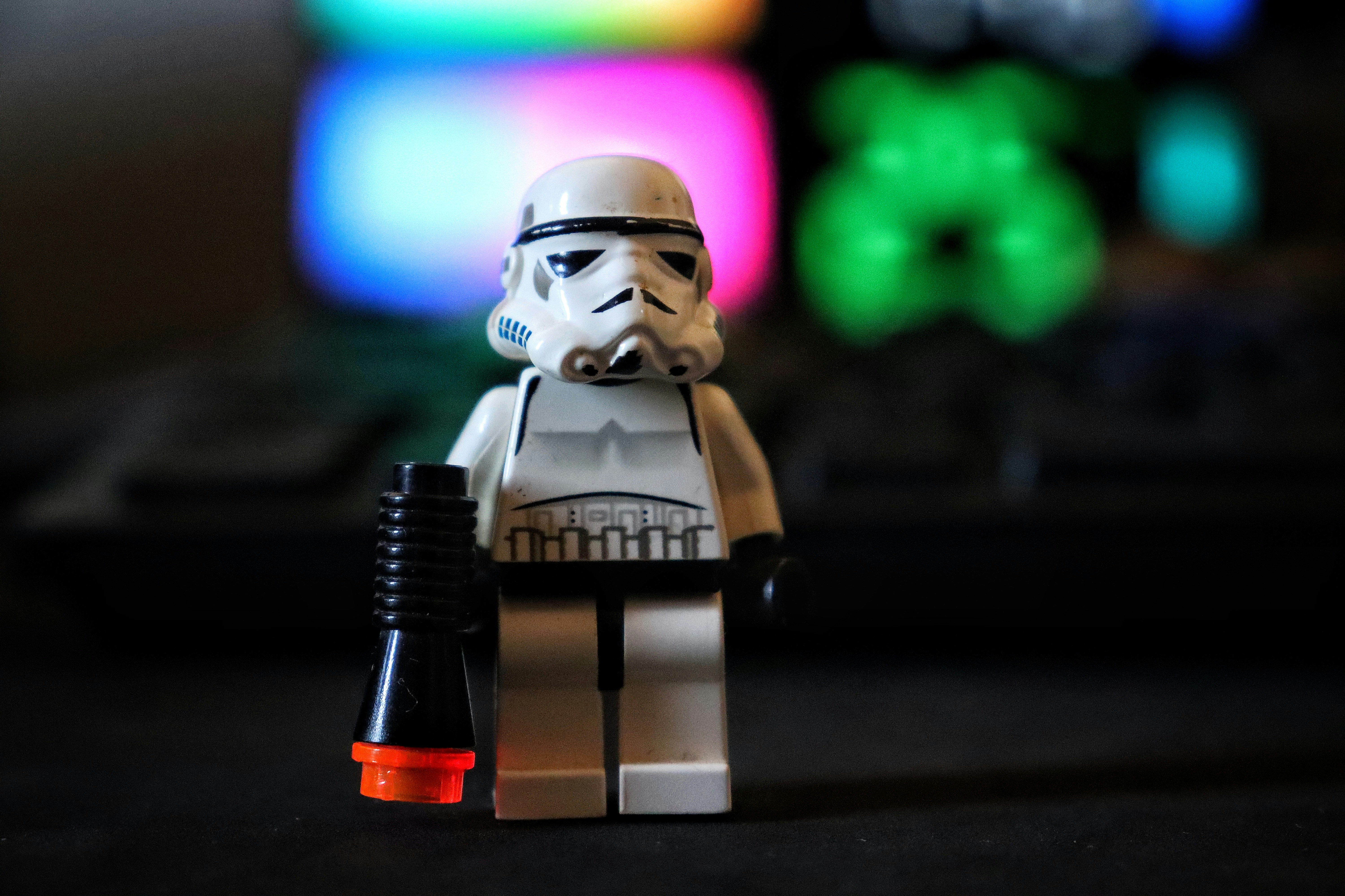 A lego star wars character holding a microphone