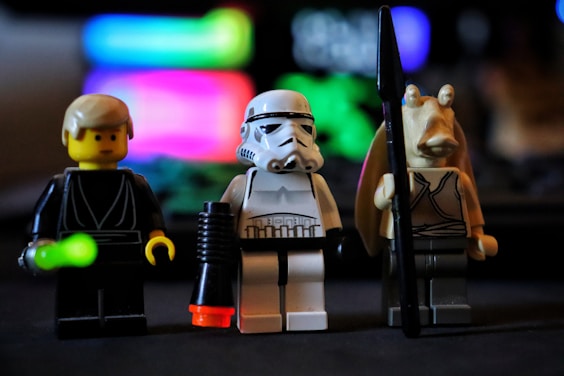 A group of star wars legos sitting on top of a table