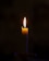 A lit candle sitting on top of a table