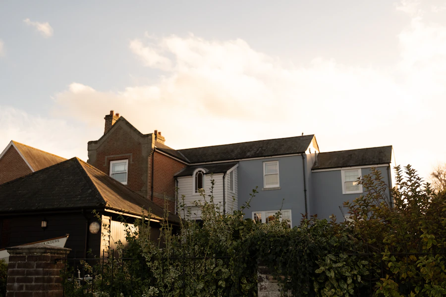 A row of houses on a hill at sunset
