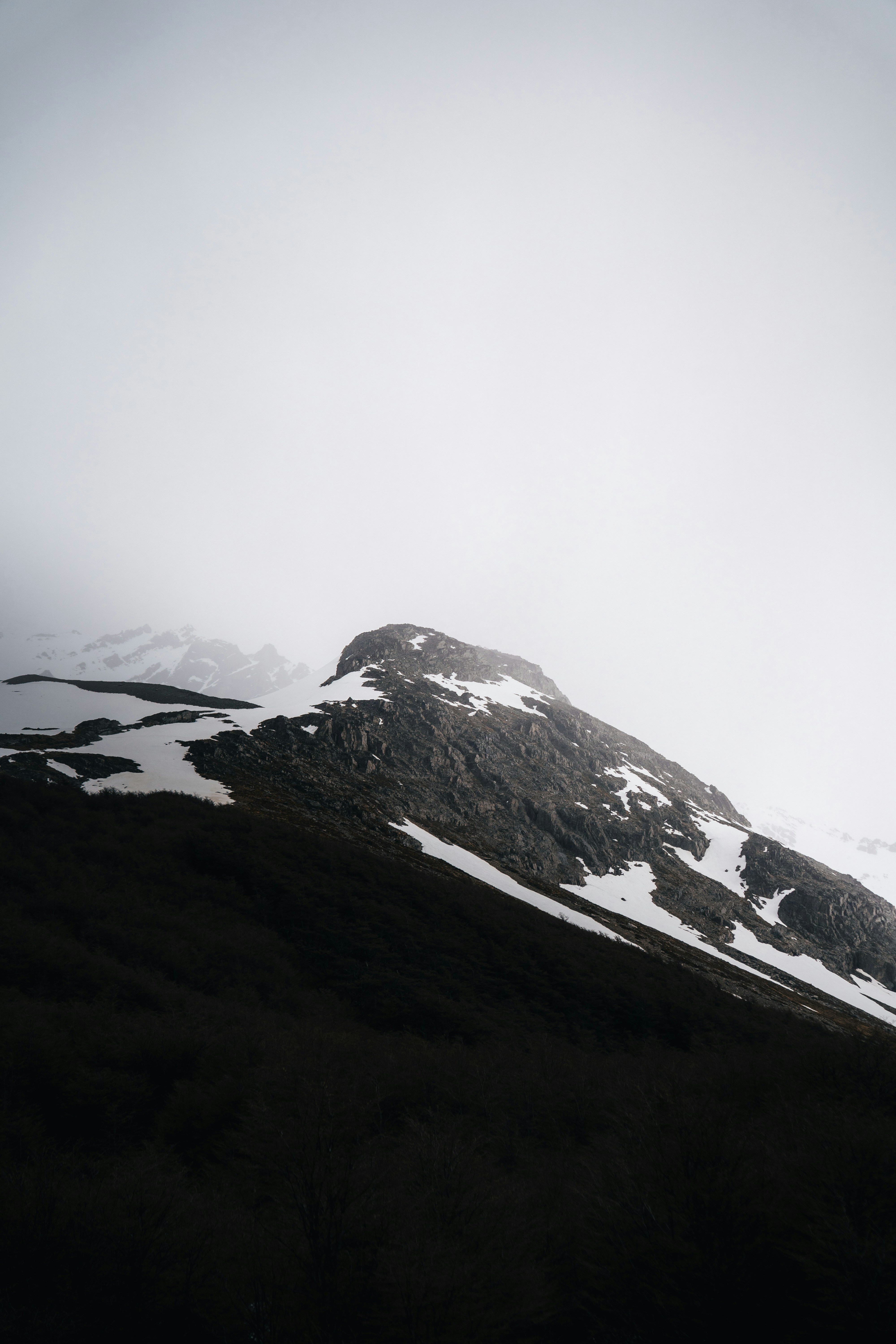 A snow covered mountain with a sky background