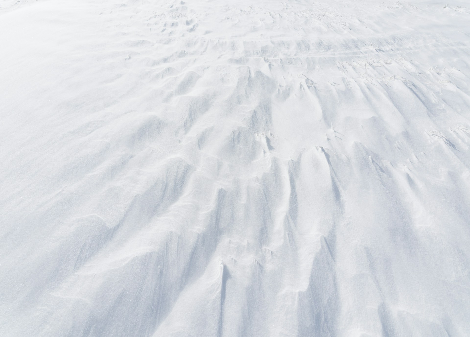 A person riding skis down a snow covered slope