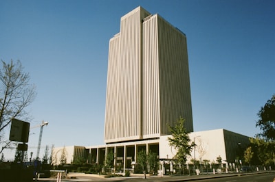 A tall building sitting on the side of a road