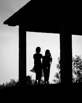 A couple of people standing next to each other