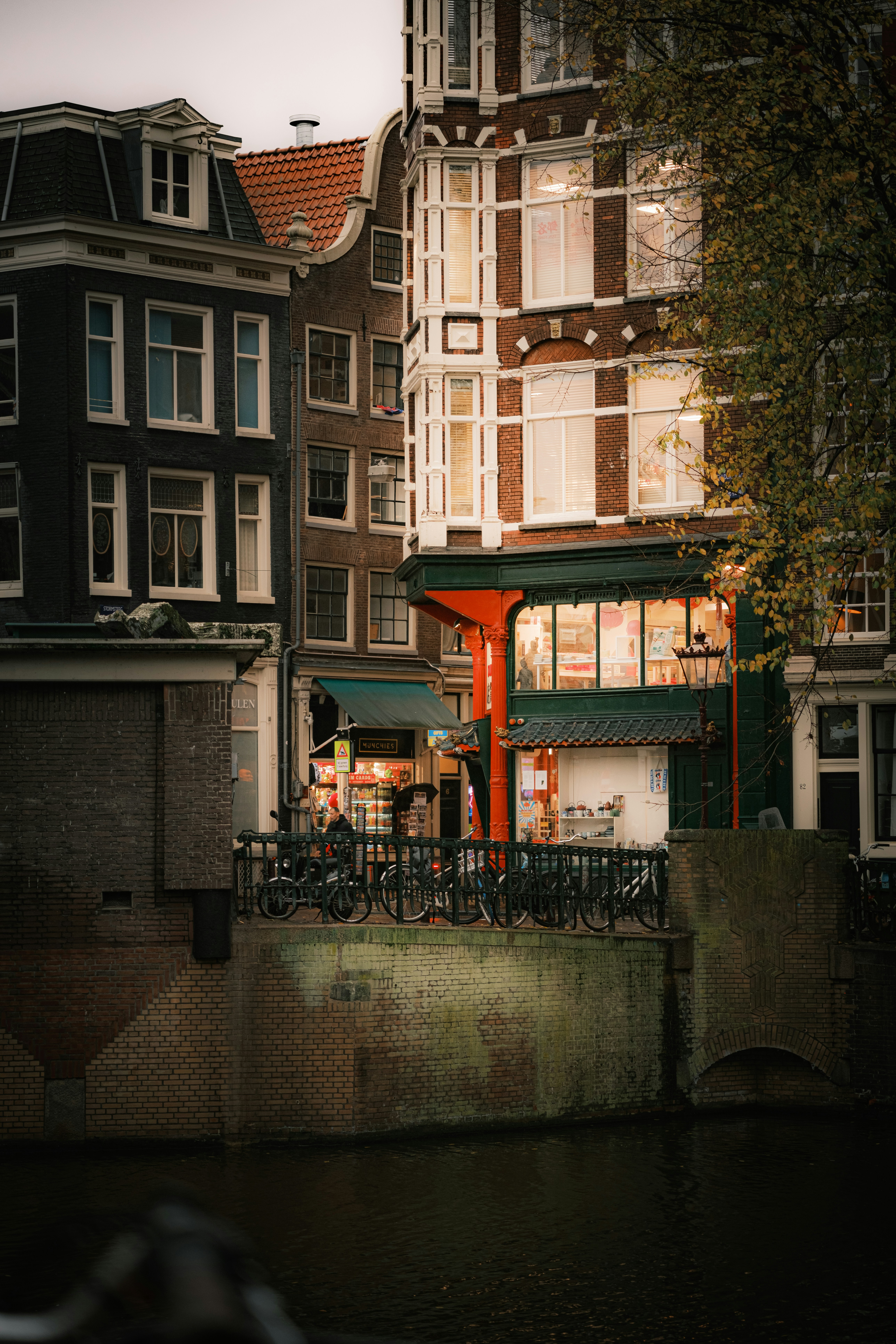 A city street with buildings and a bridge