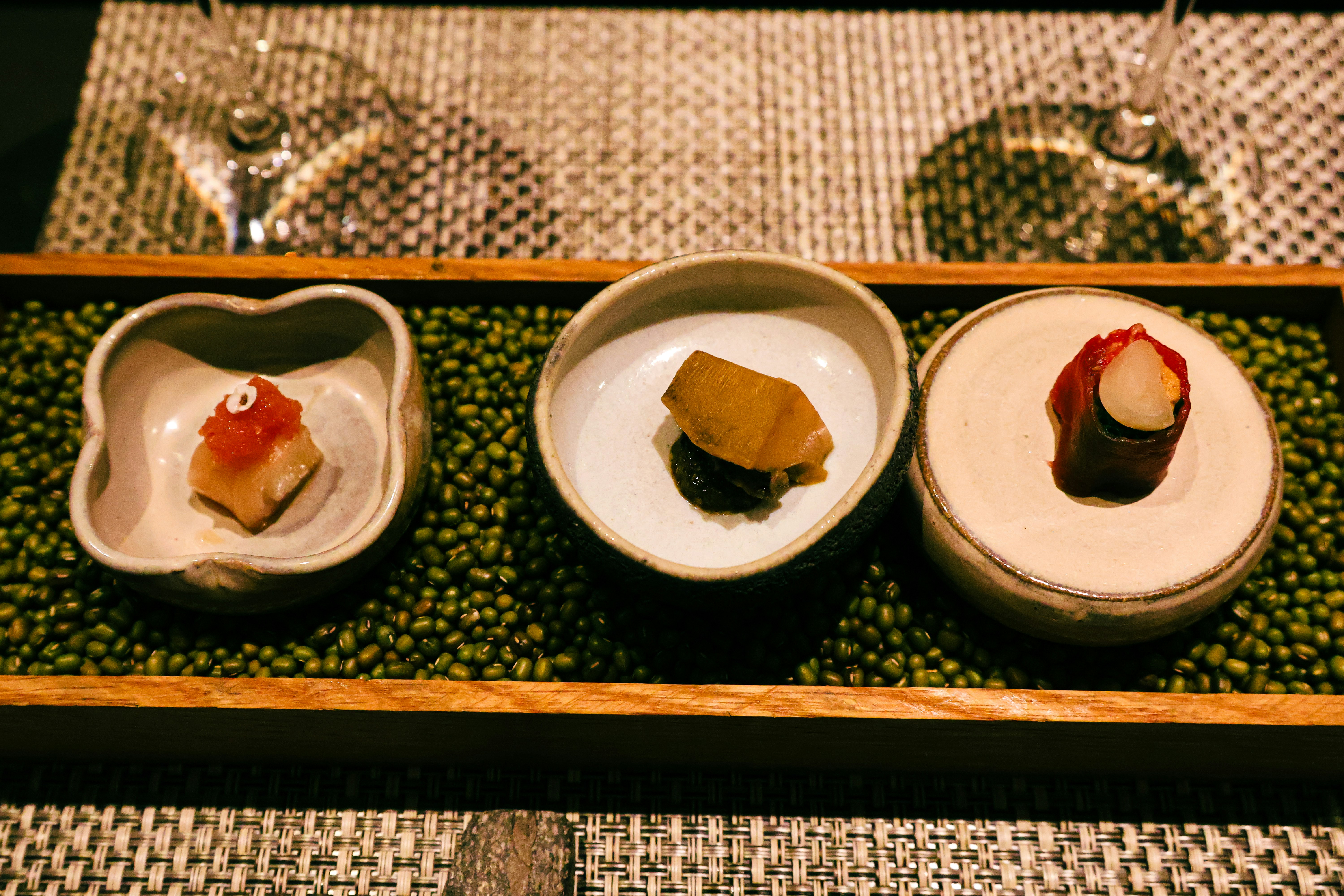 Three plates of food on a tray on a table