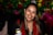 A woman holding a can of beer in her hand