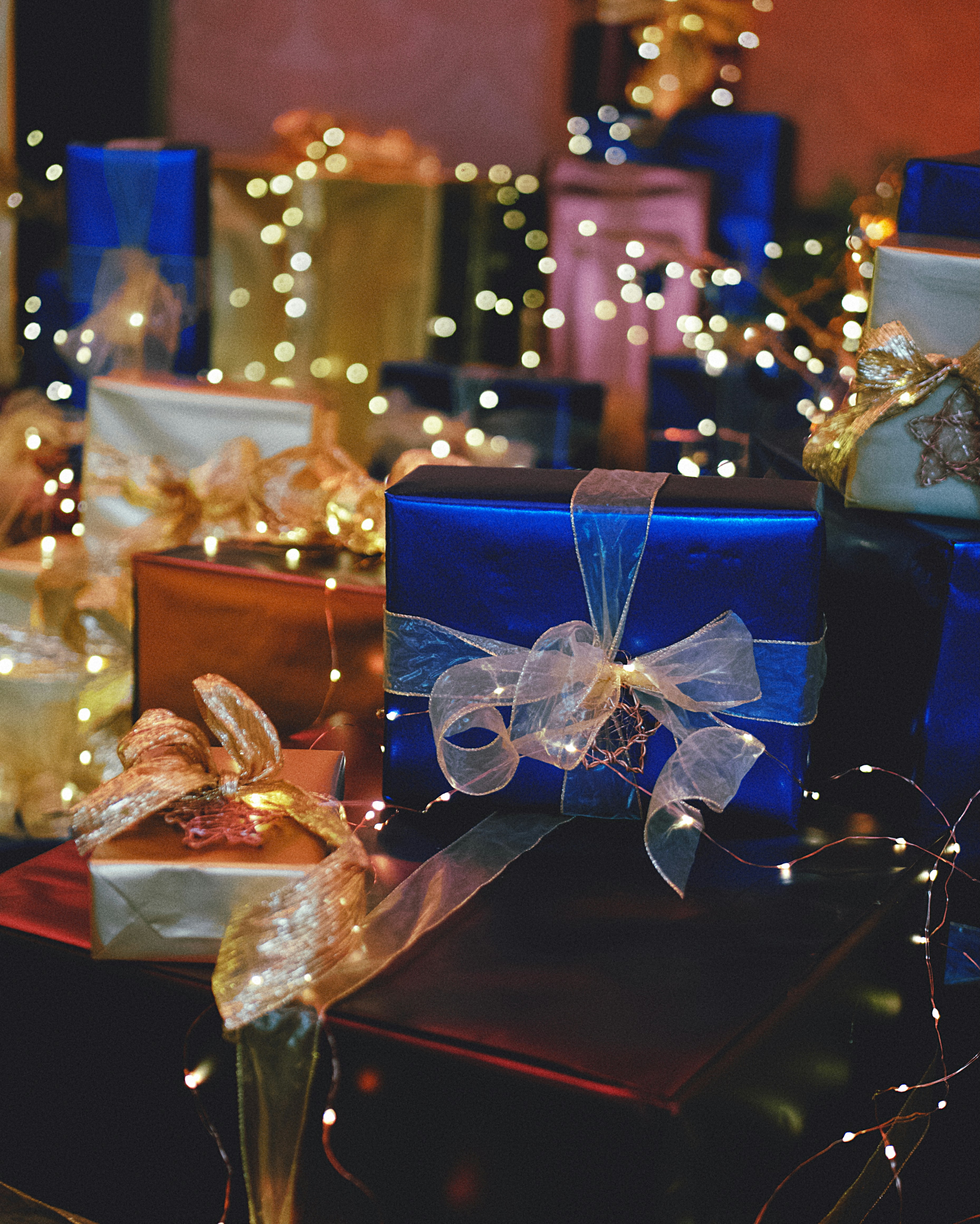 A group of wrapped presents sitting on top of a table
