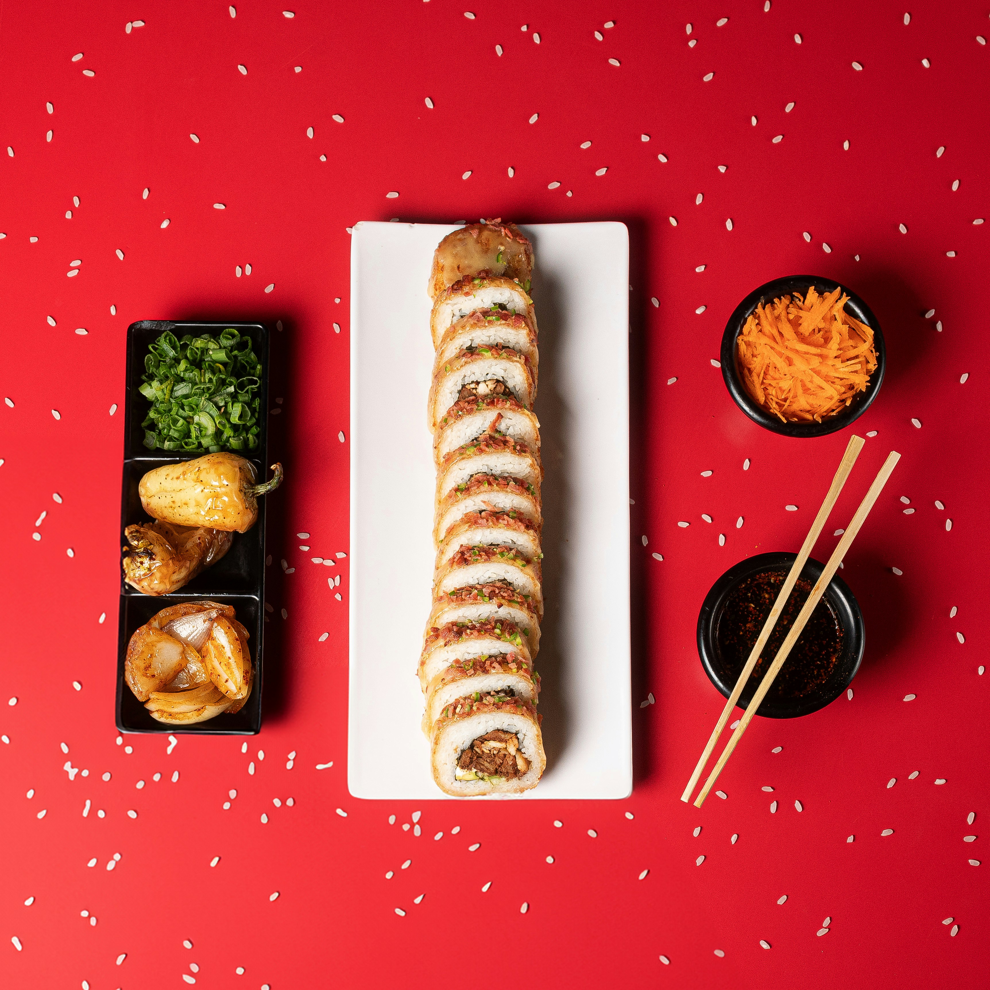 A plate of food on a table with chopsticks