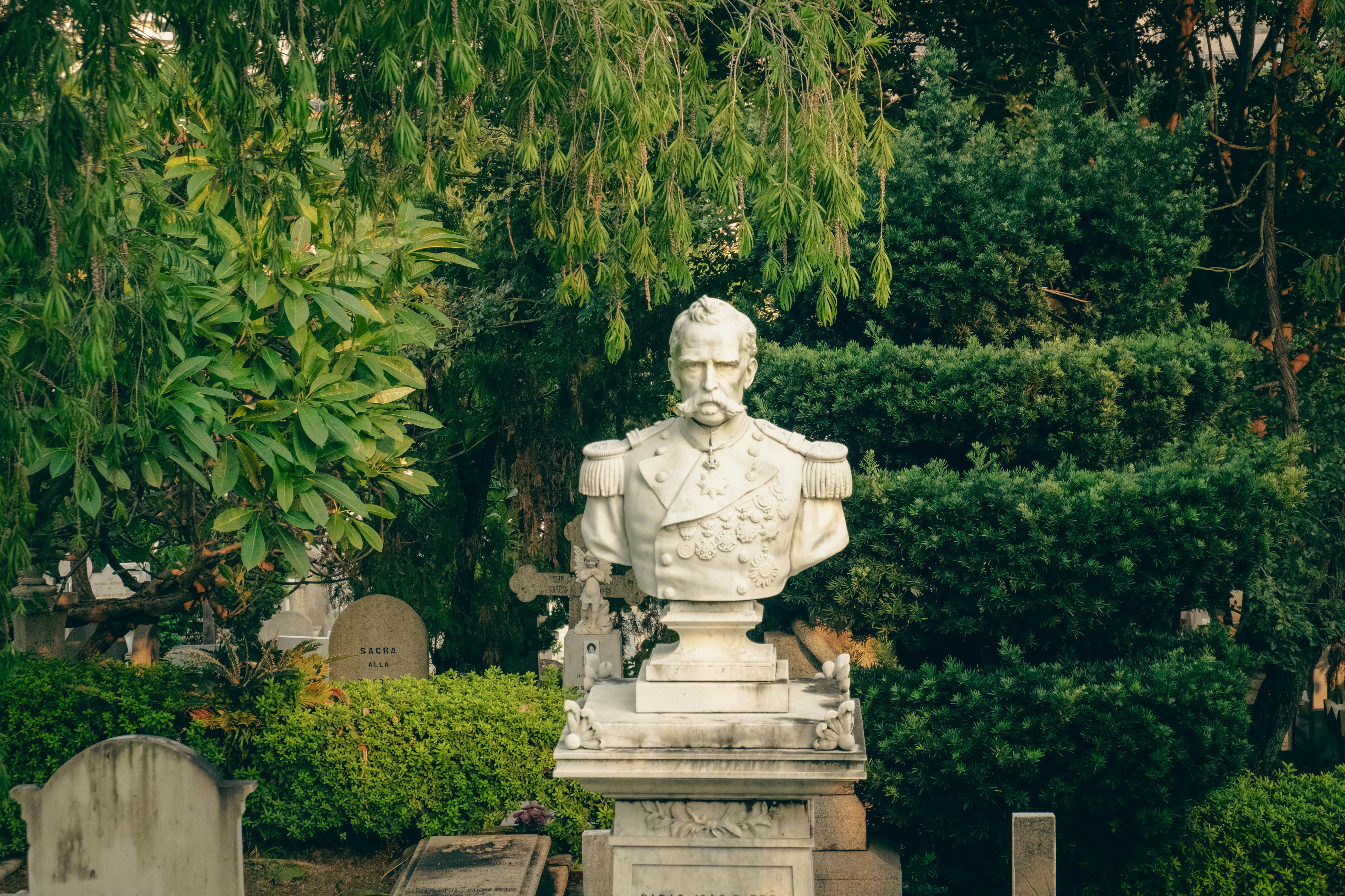 A statue of a man in a cemetery