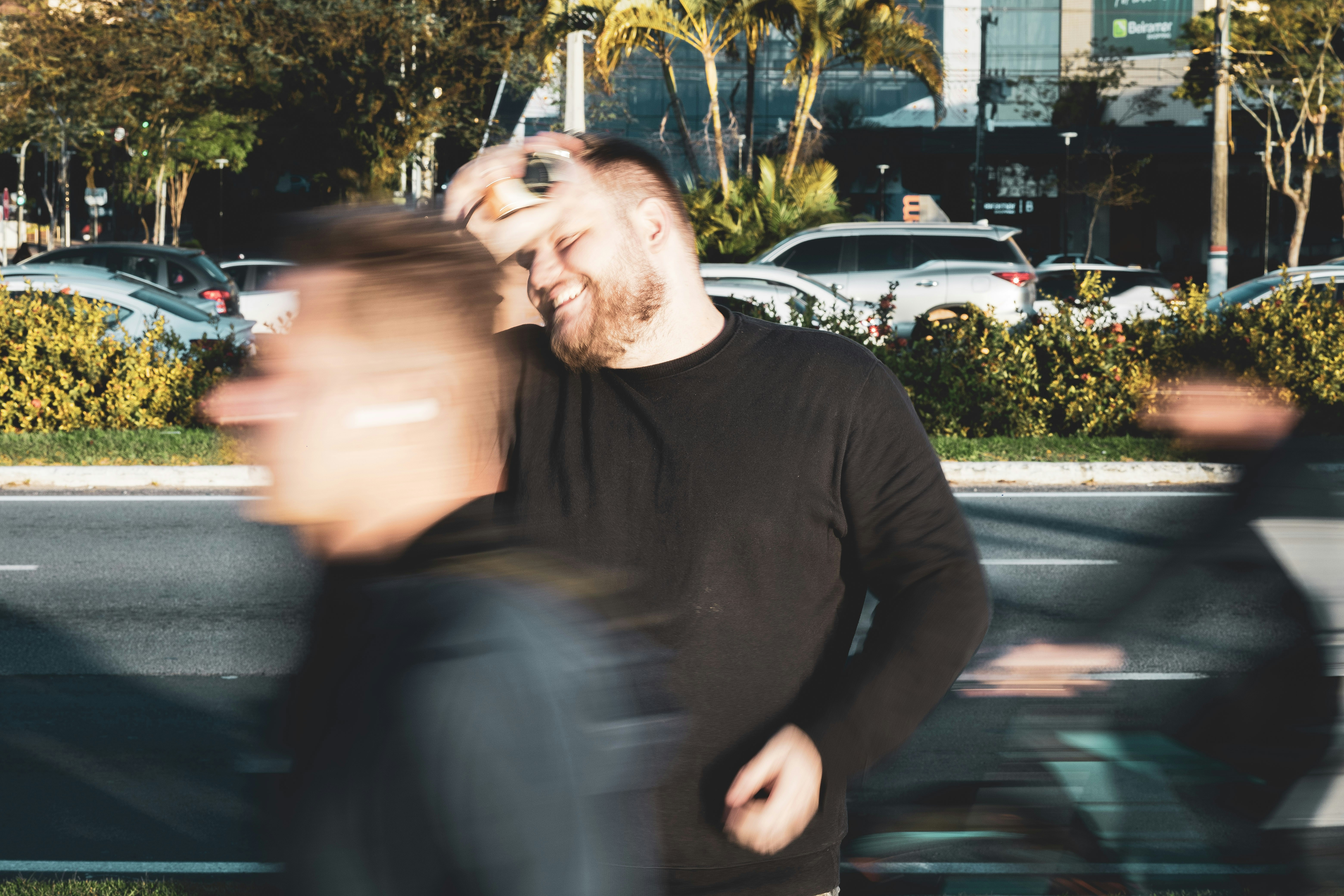 A blurry photo of a man talking on a cell phone
