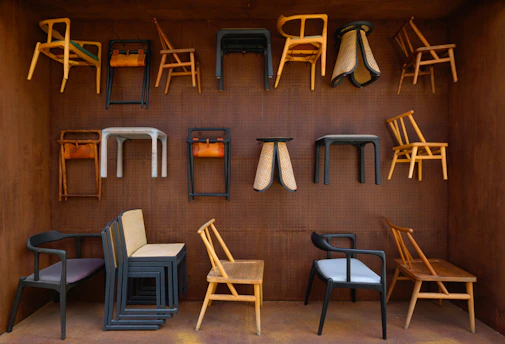 A room filled with lots of different types of chairs
