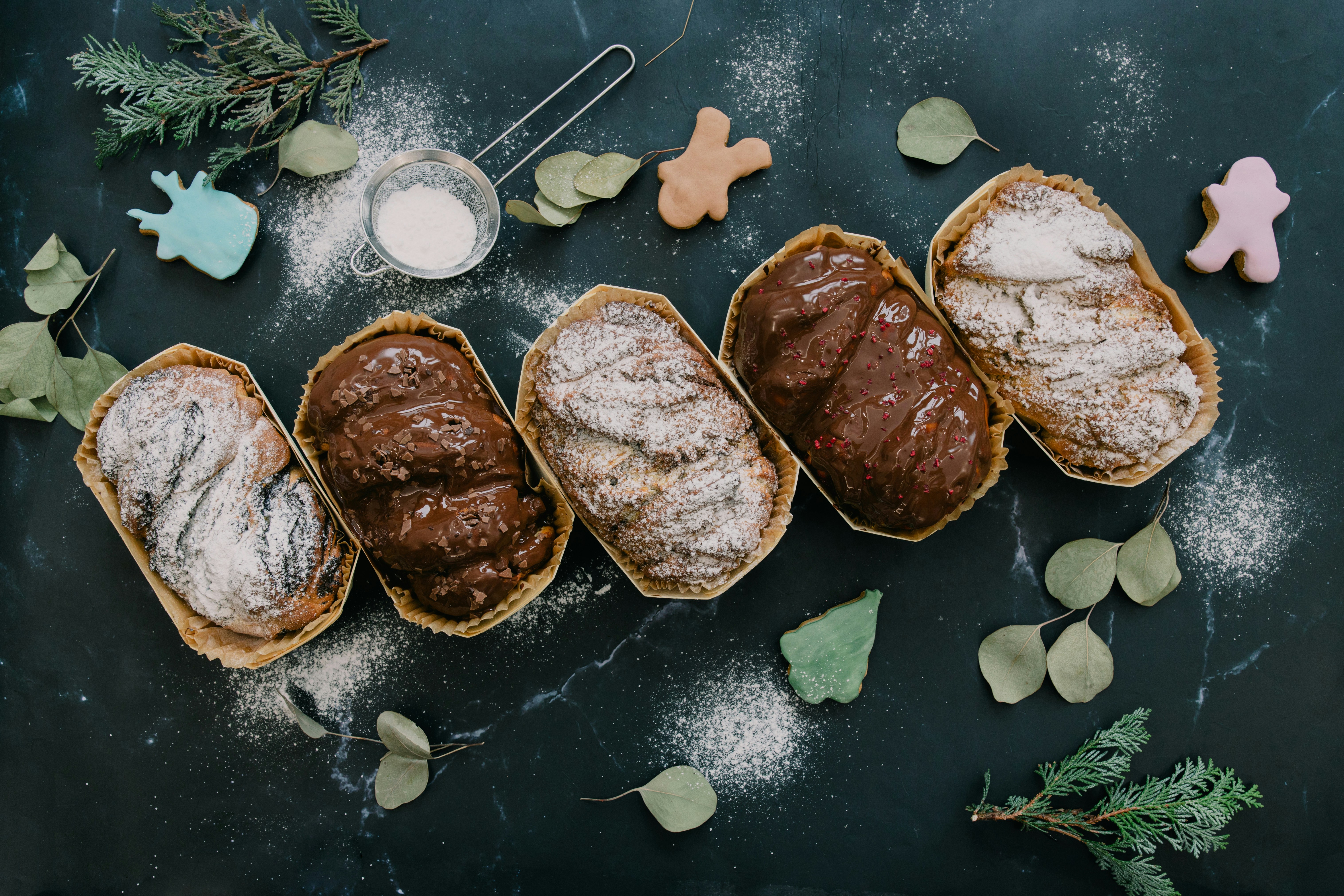A table topped with sandwiches covered in frosting