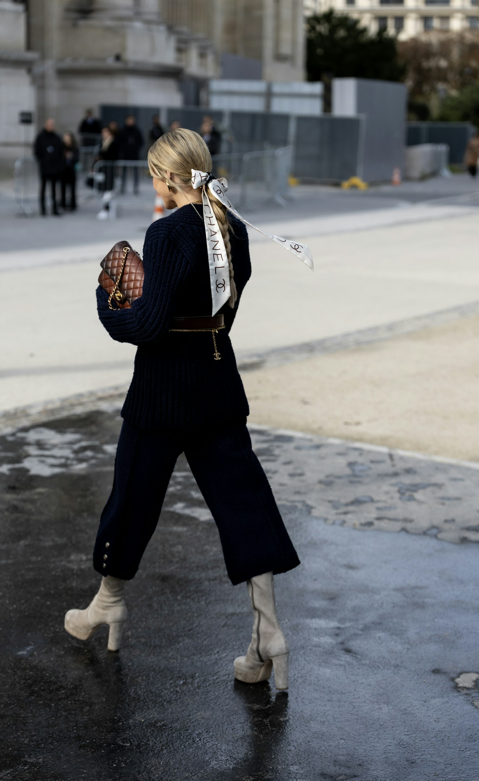 Woman walking in Paris with umbrella