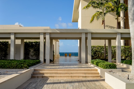 A large building with steps leading to the beach