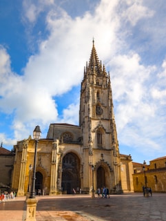 A large cathedral with a clock on the front of it