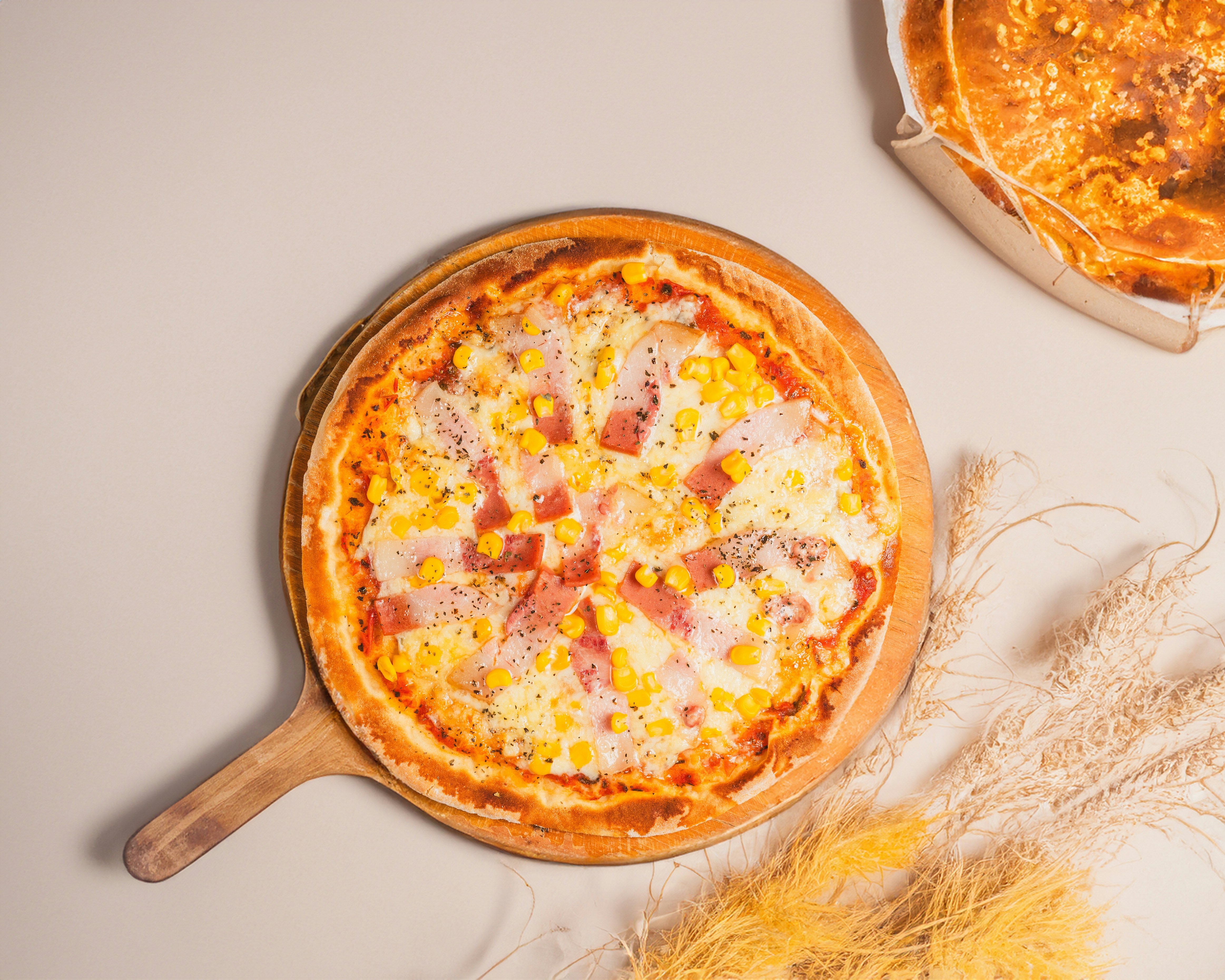 A couple of pizzas sitting on top of a table