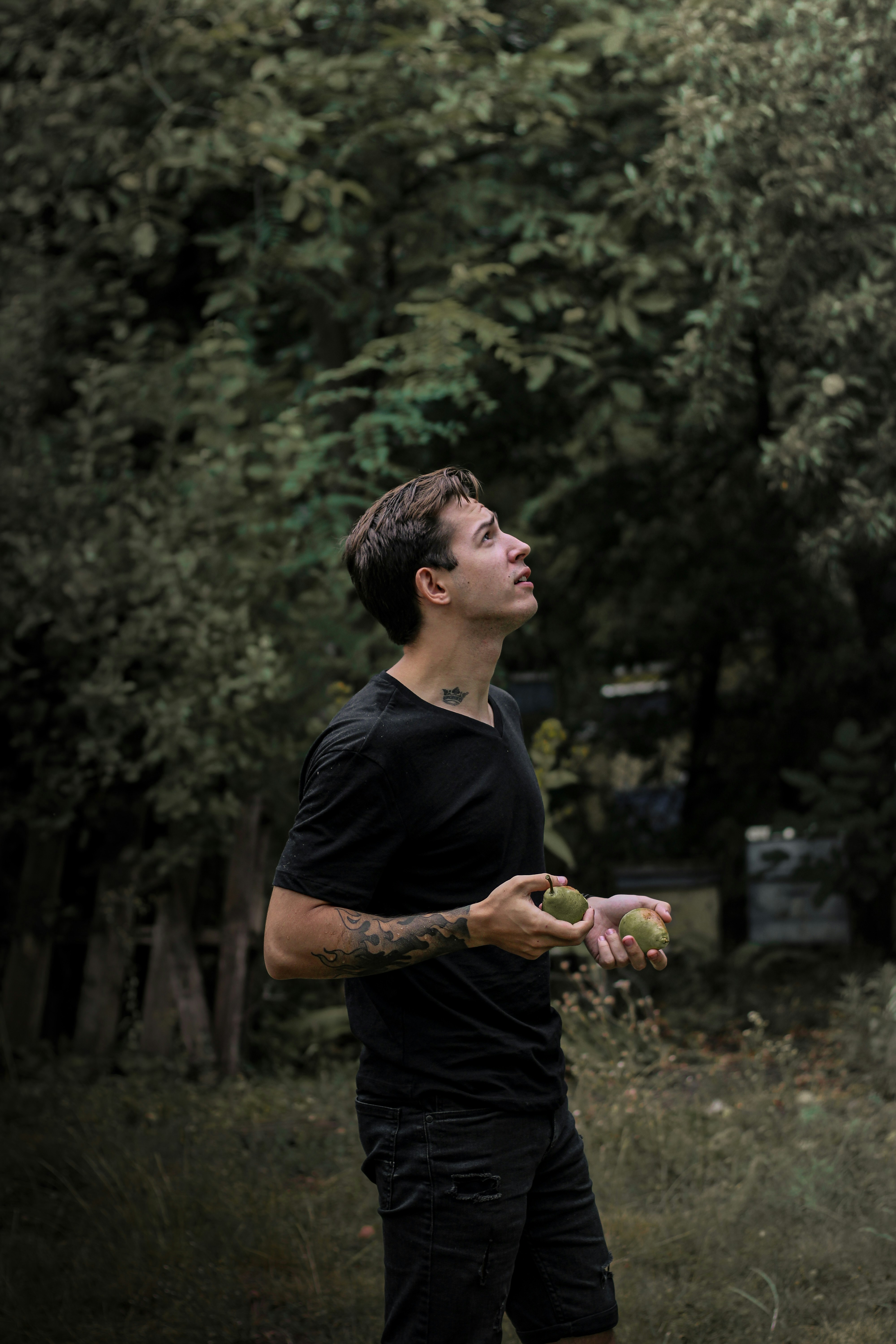 A man standing in a field holding a frisbee