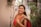 A woman in a red and green sari -
