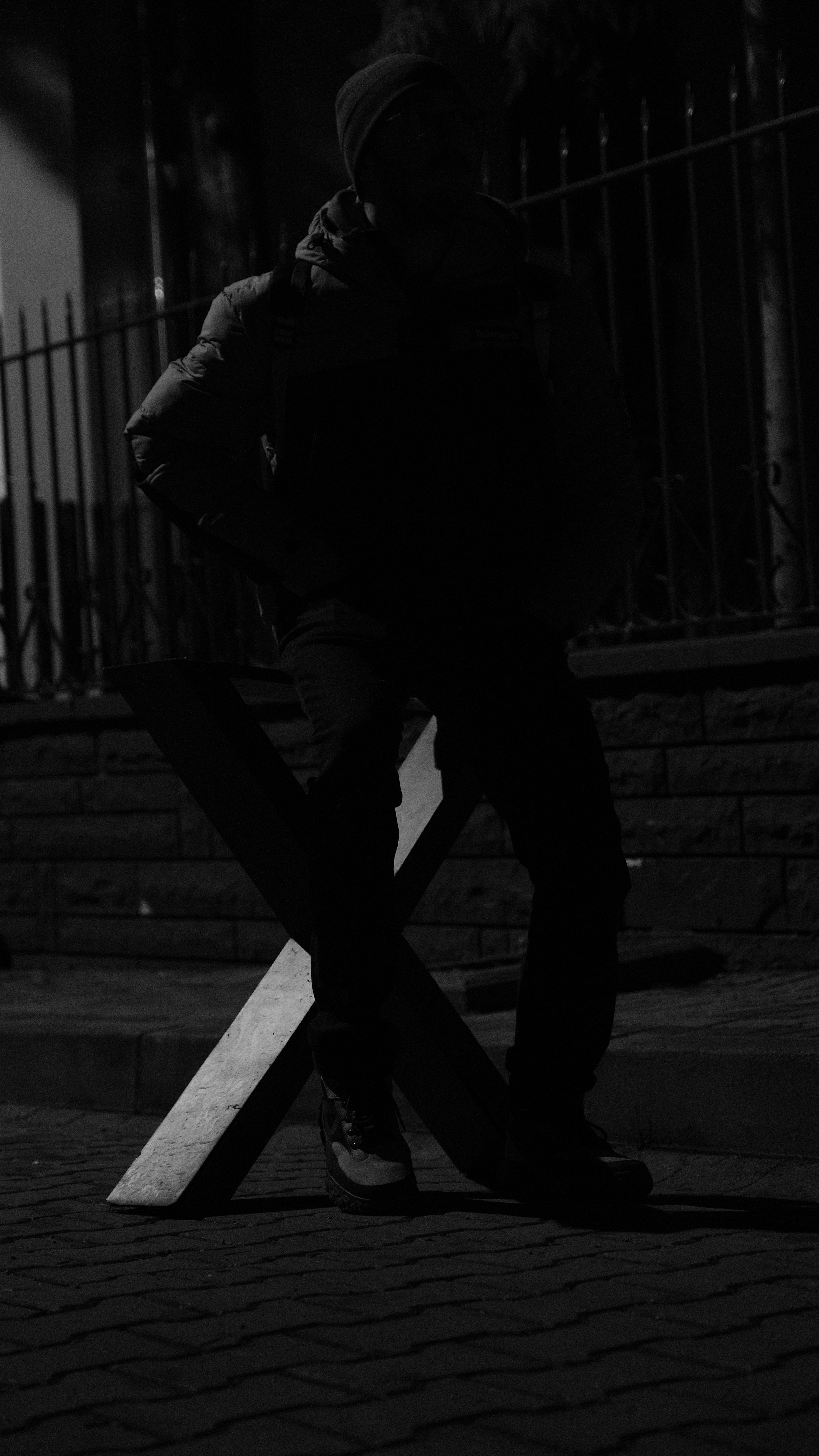 A person walking up some steps at night