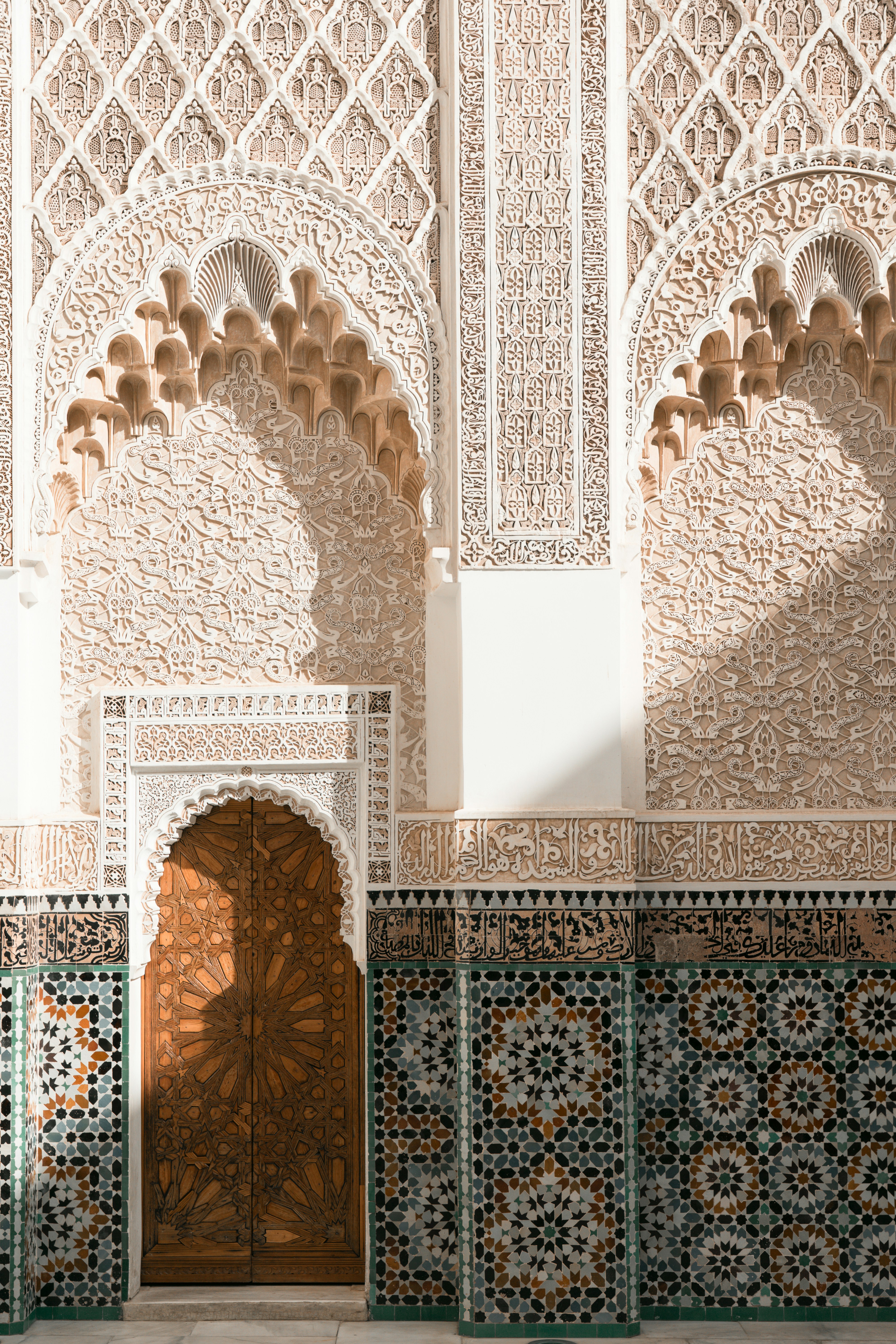 A doorway in a building with a tiled wall