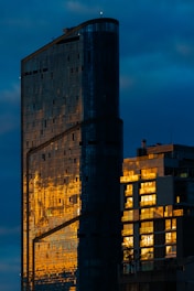 A very tall building sitting next to a tall building