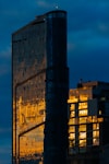 A very tall building sitting next to a tall building