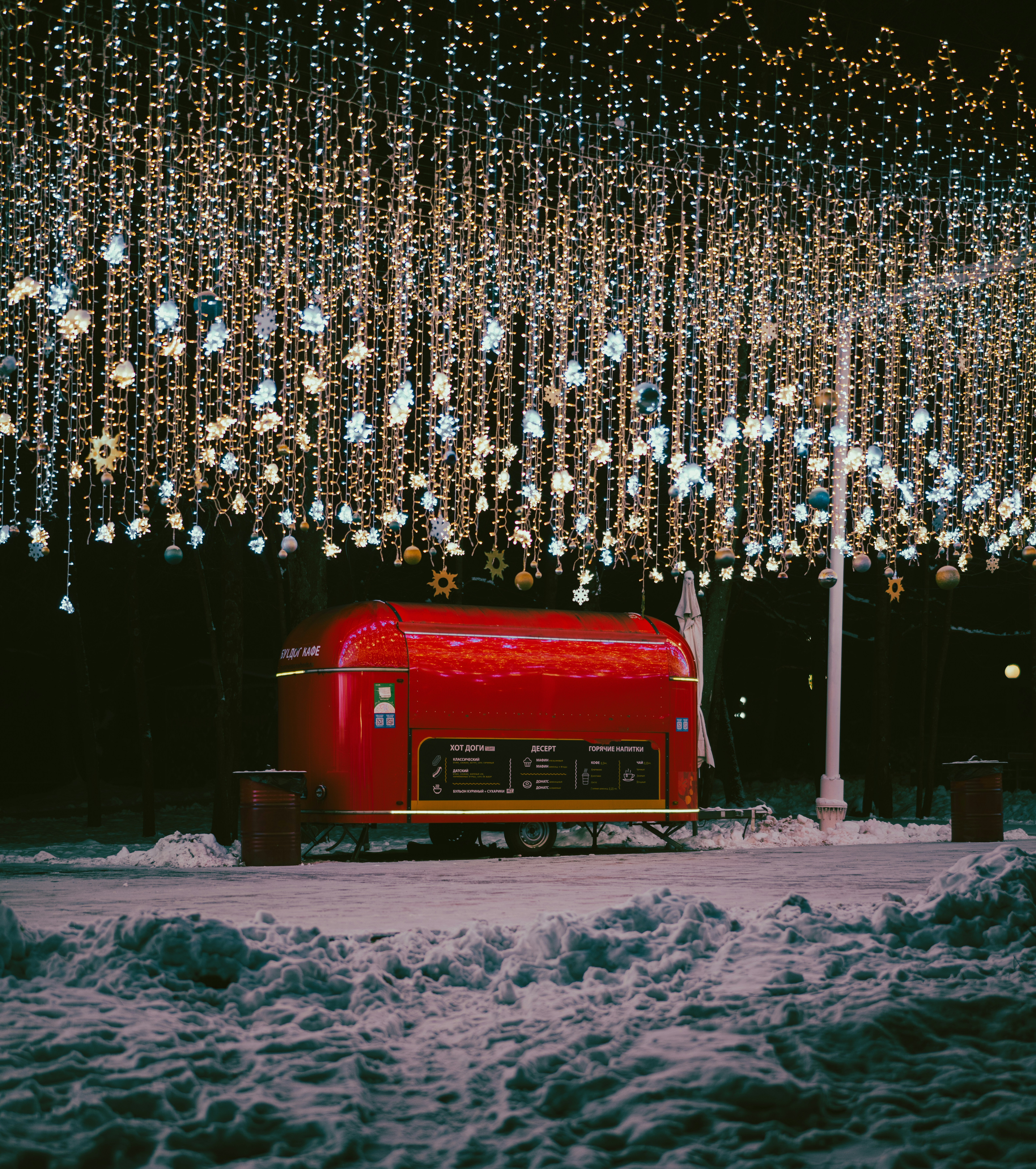 A red truck parked in front of a building
