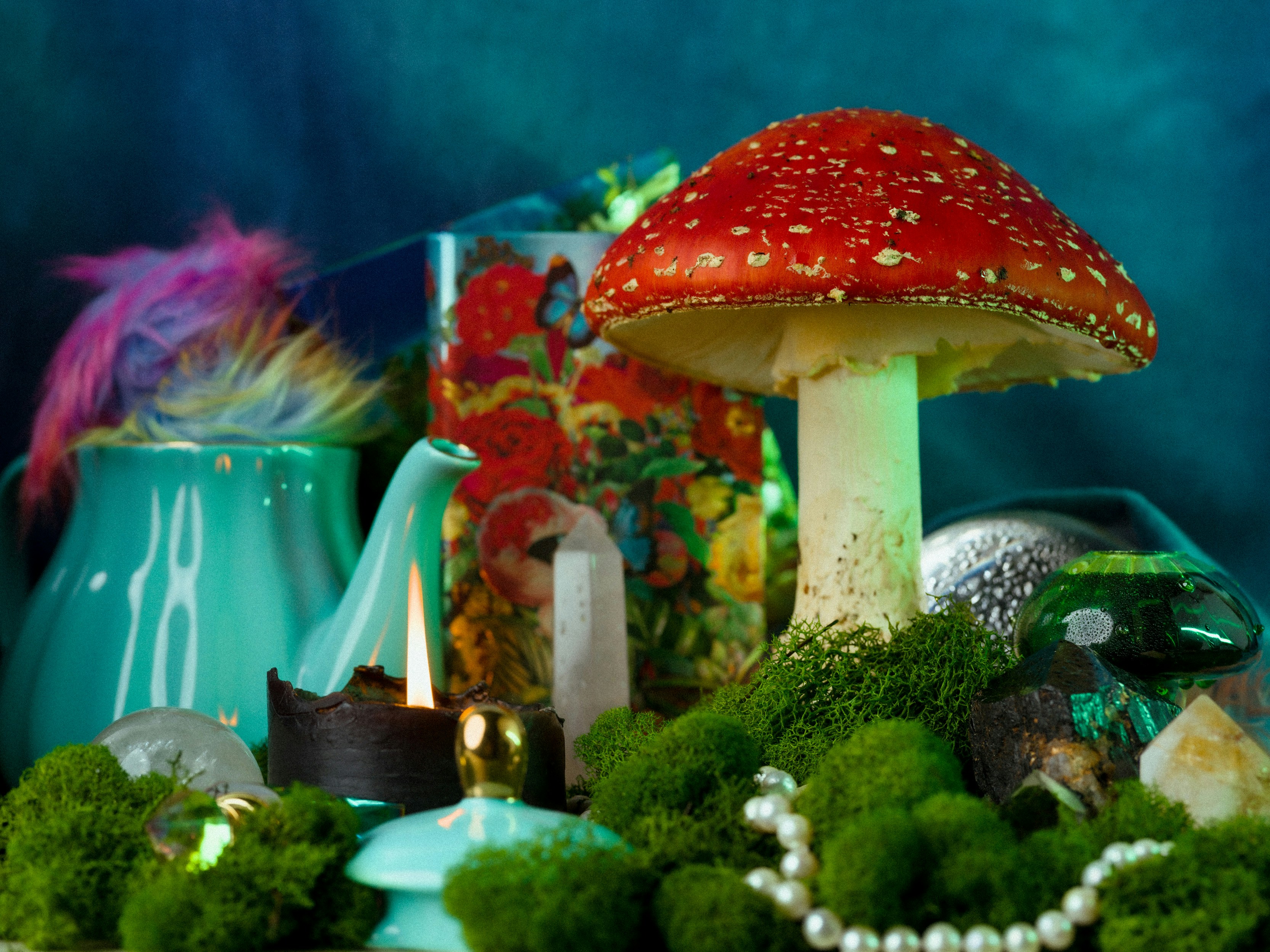 A table topped with lots of green plants and mushrooms