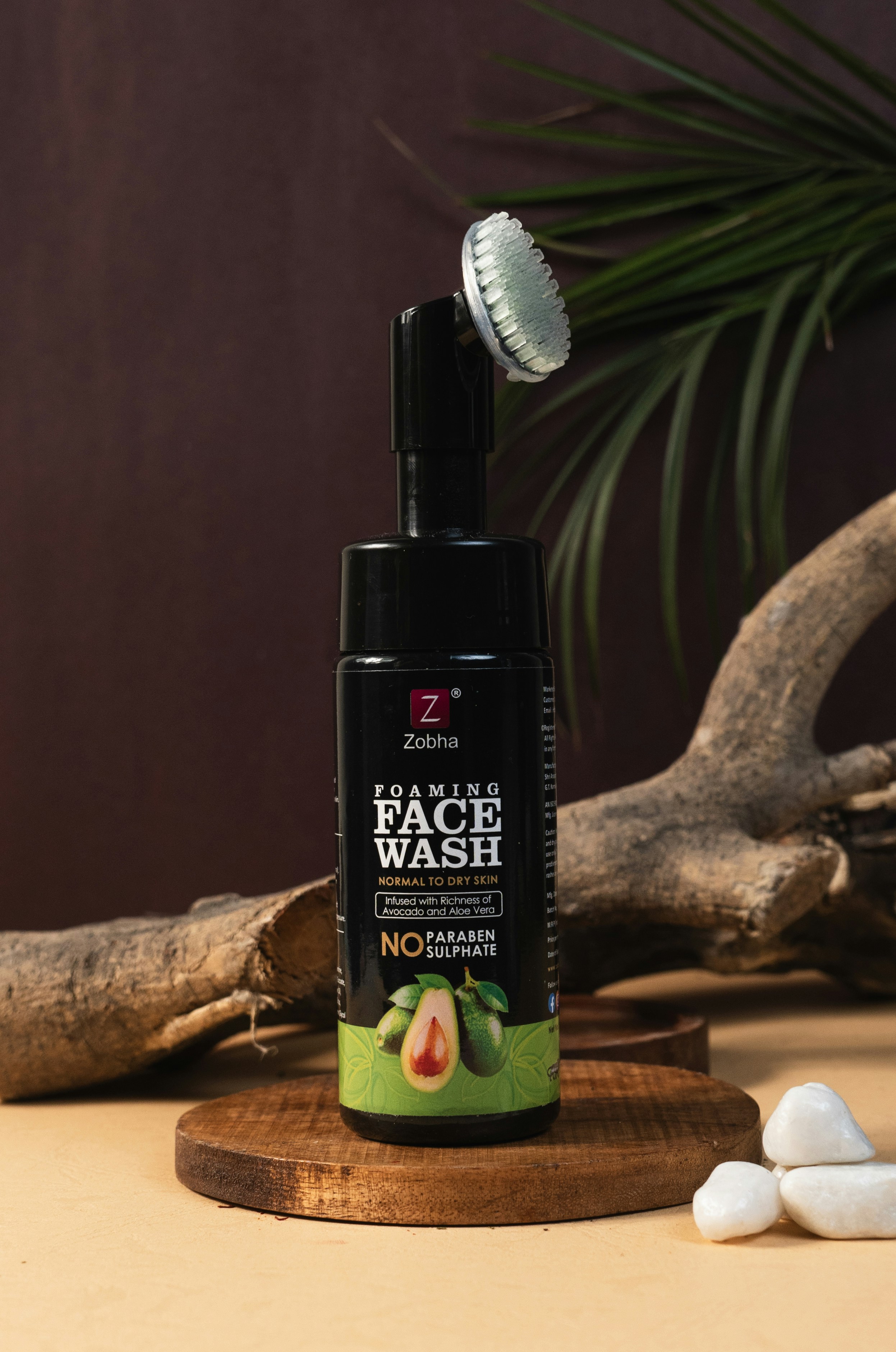 A bottle of face wash sitting on top of a table