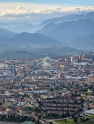 A view of a city with mountains in the background