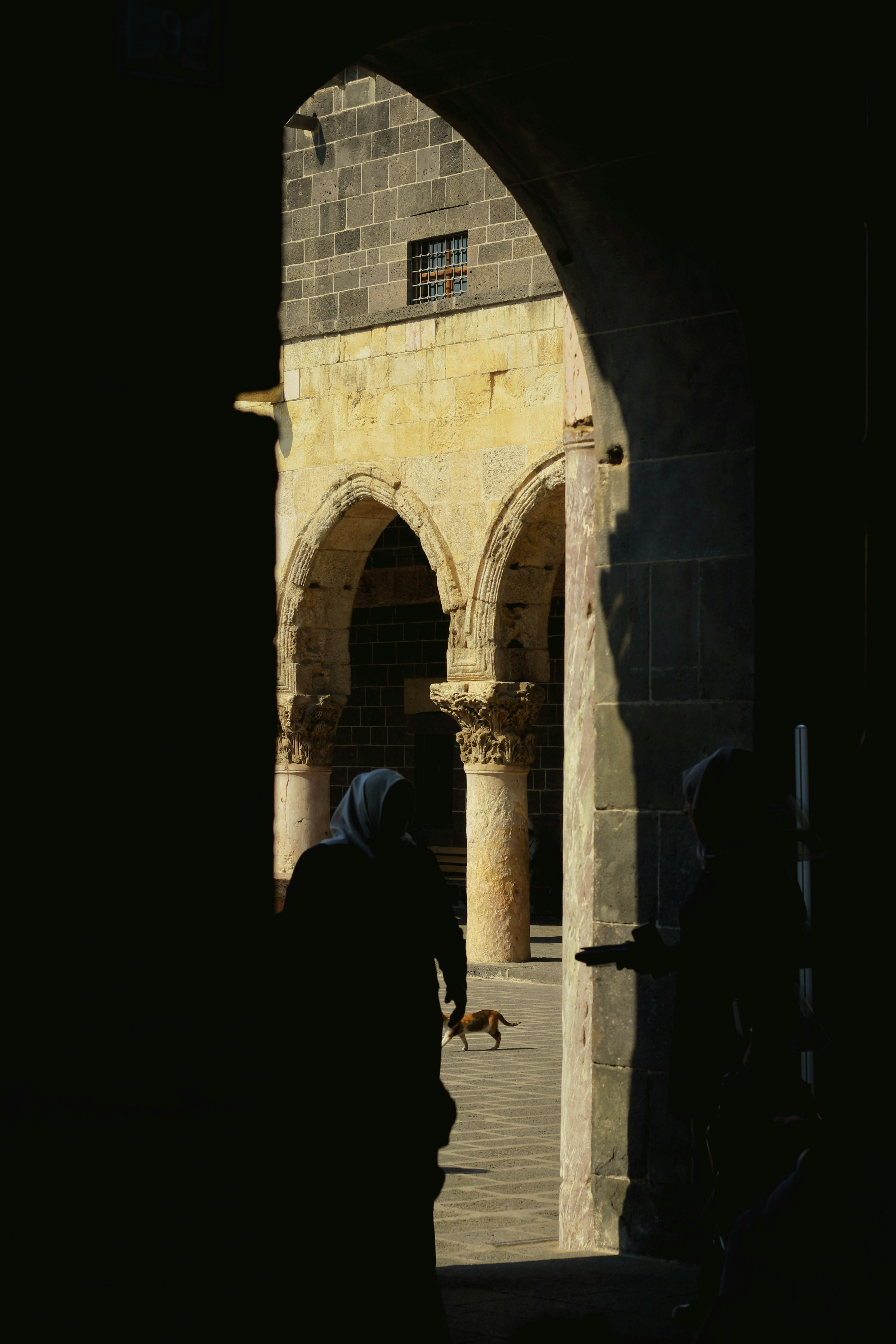 A person standing in a doorway of a building