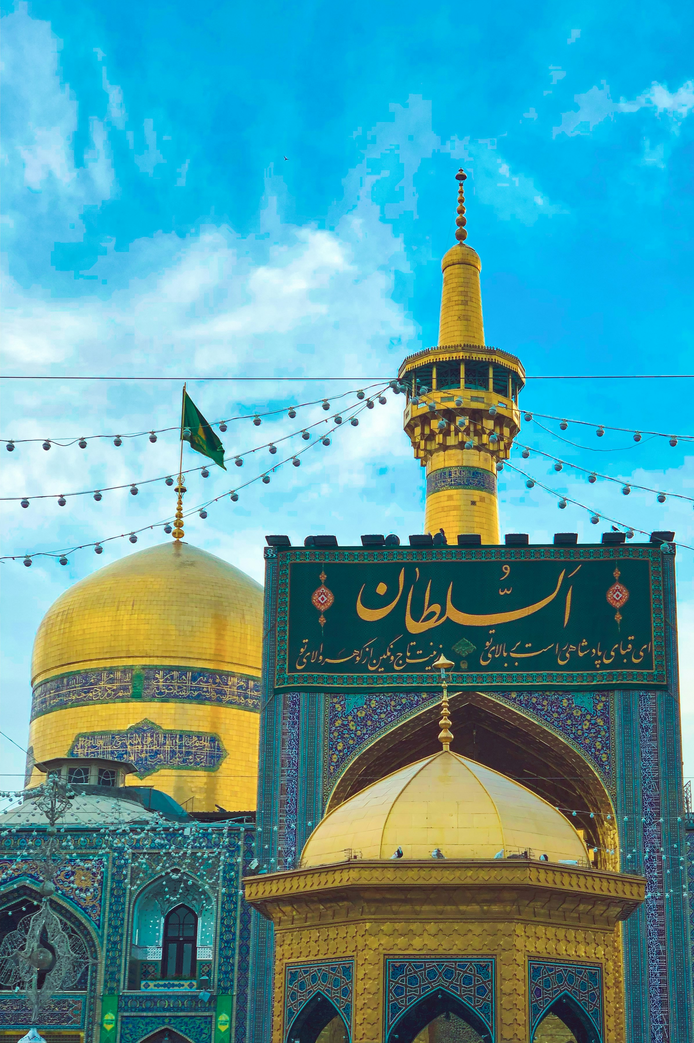 A large yellow and blue building with a yellow dome