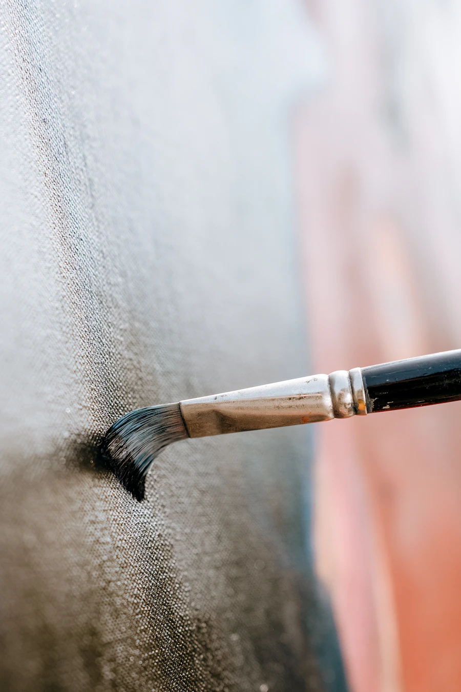 Close up paintbrush on wall