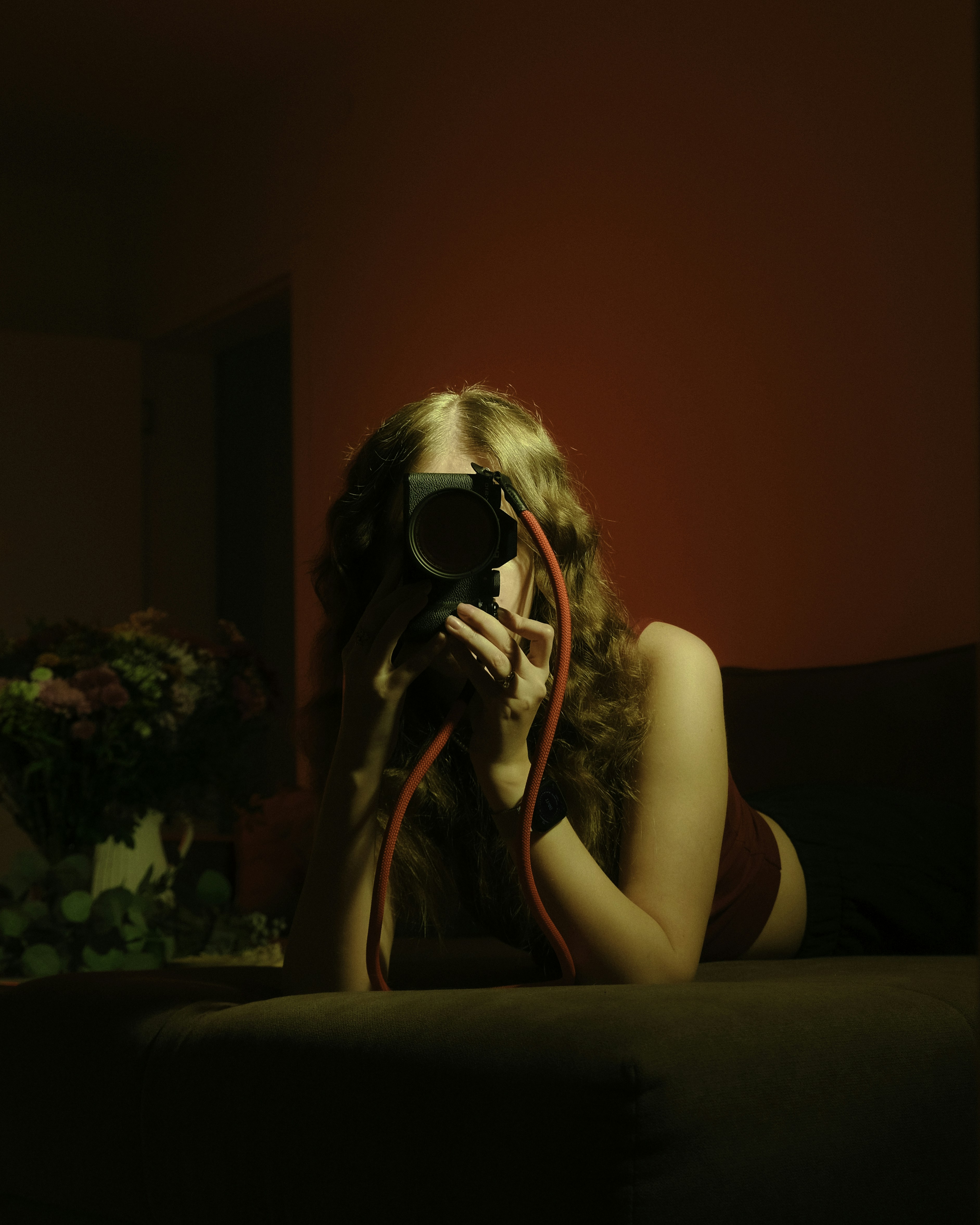 A woman taking a picture of herself with a camera