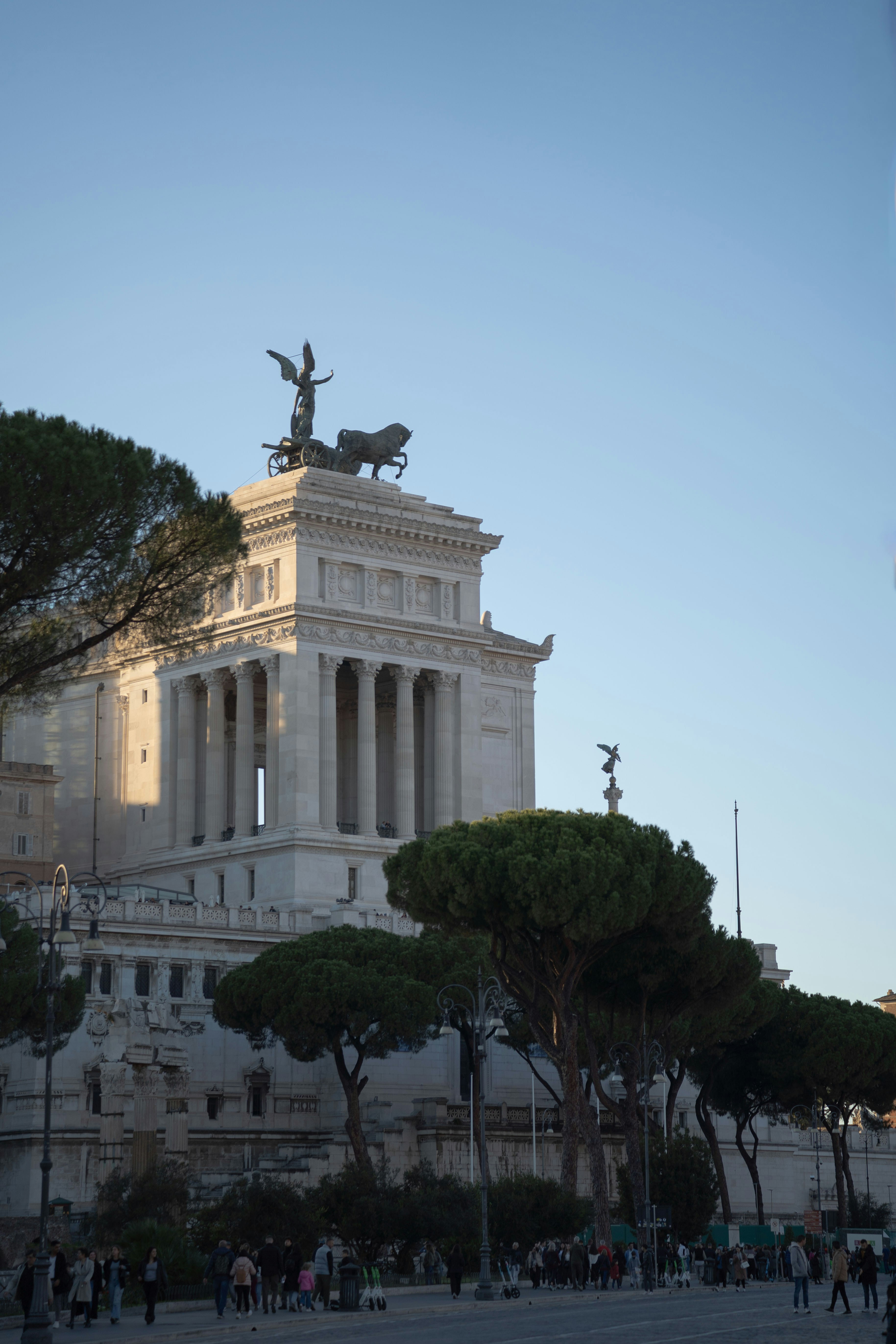 A very tall building with a statue on top of it