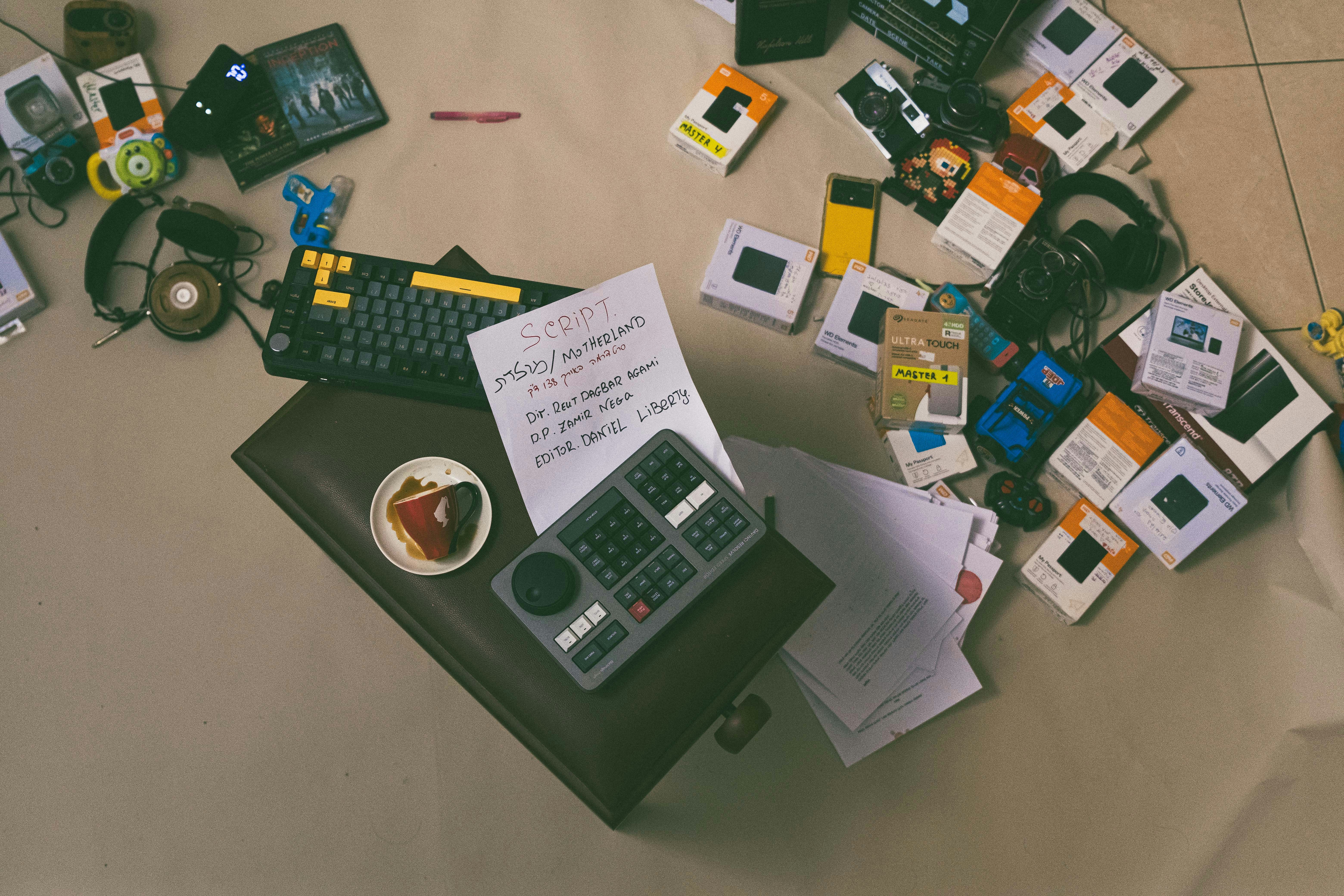 A table topped with a calculator and other items