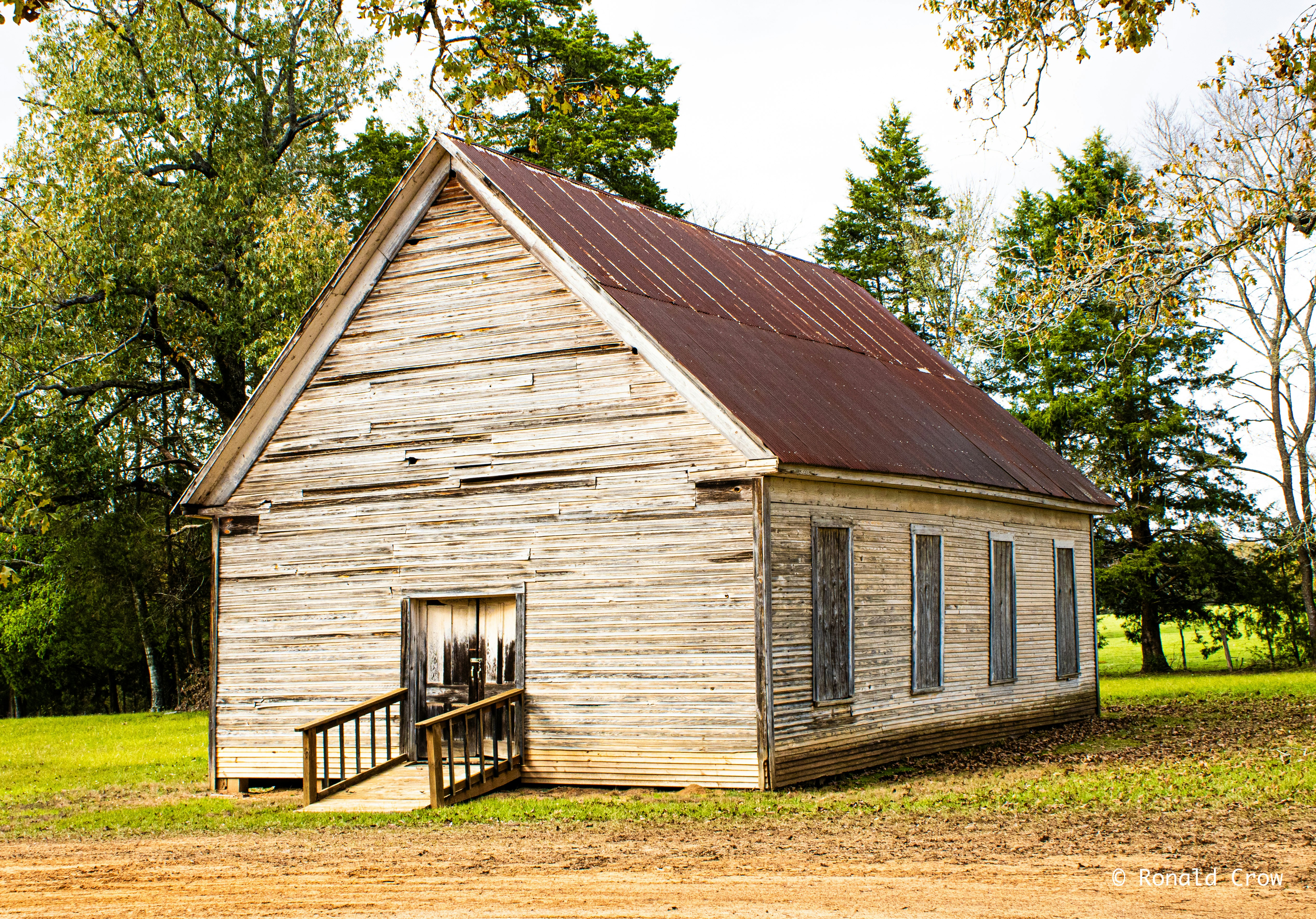 An old building with a porch and a door