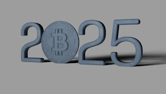 A blue bitcoin sitting on top of a gray surface