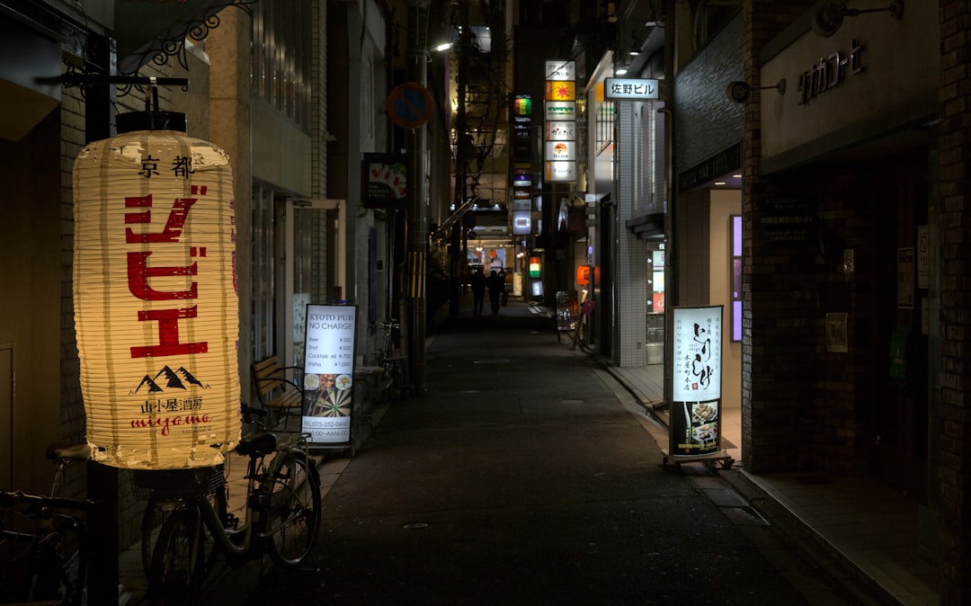 A dark alley with a sign on the side of it, 2024-01-10