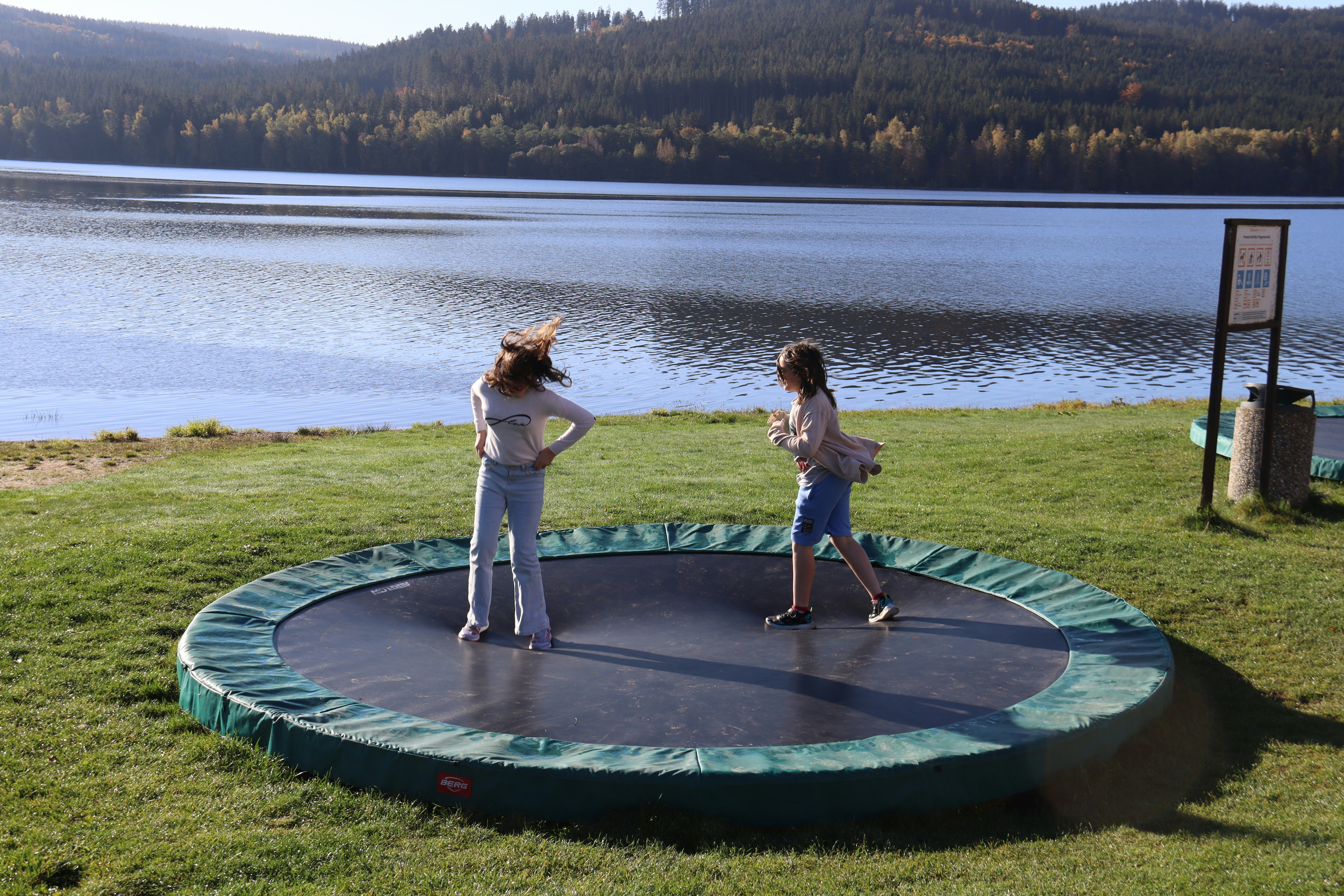 Two young girls on trampoline