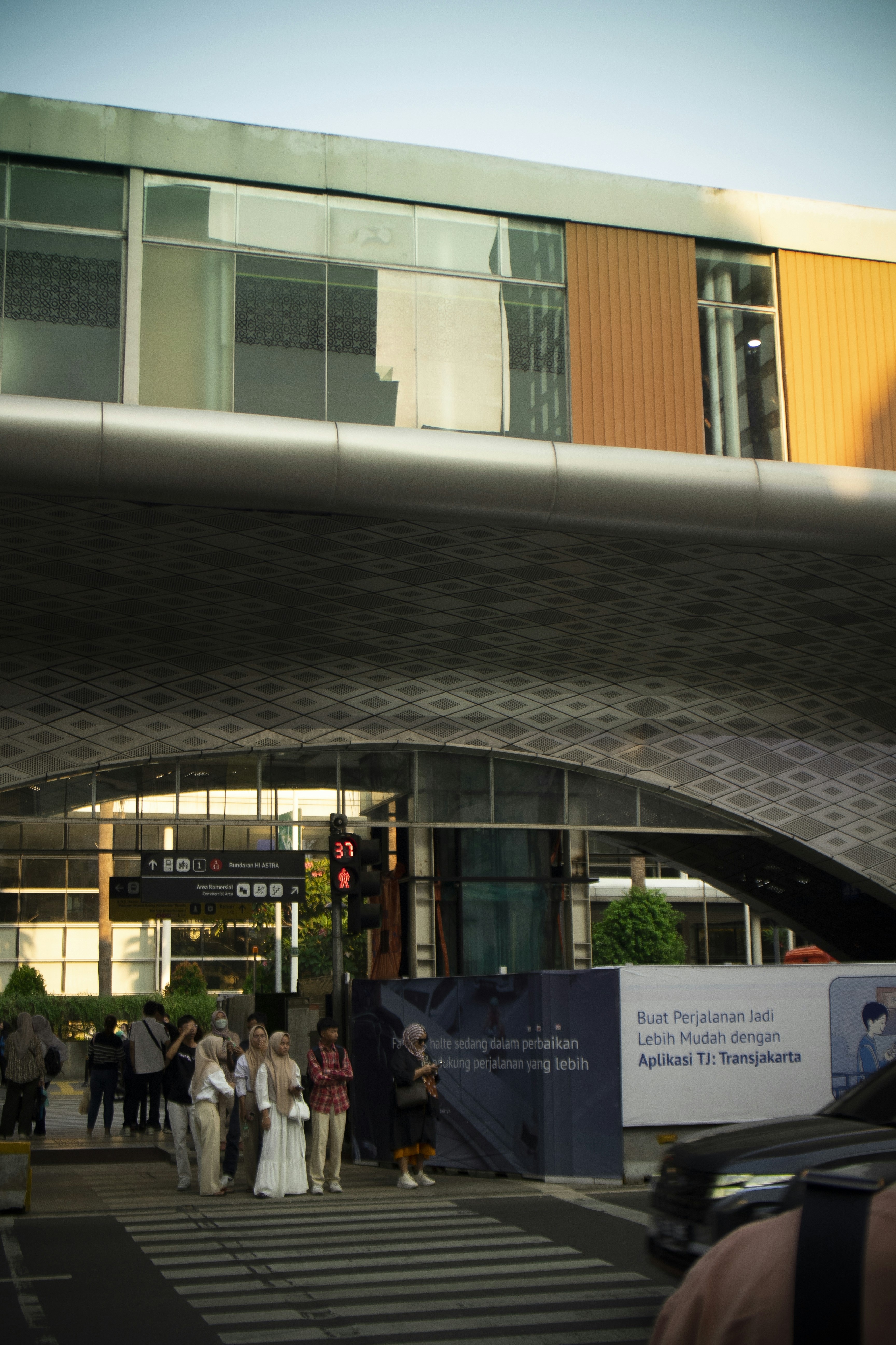 A group of people standing outside of a building