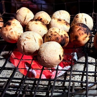 A bunch of food that is on a grill