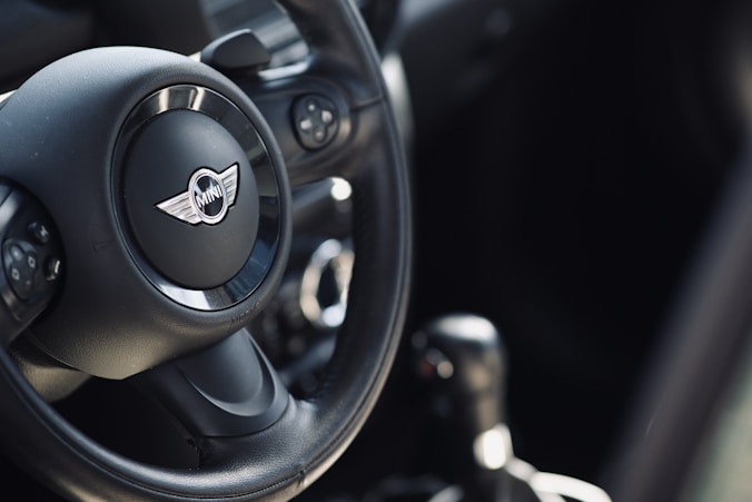 A steering wheel and dashboard of a car