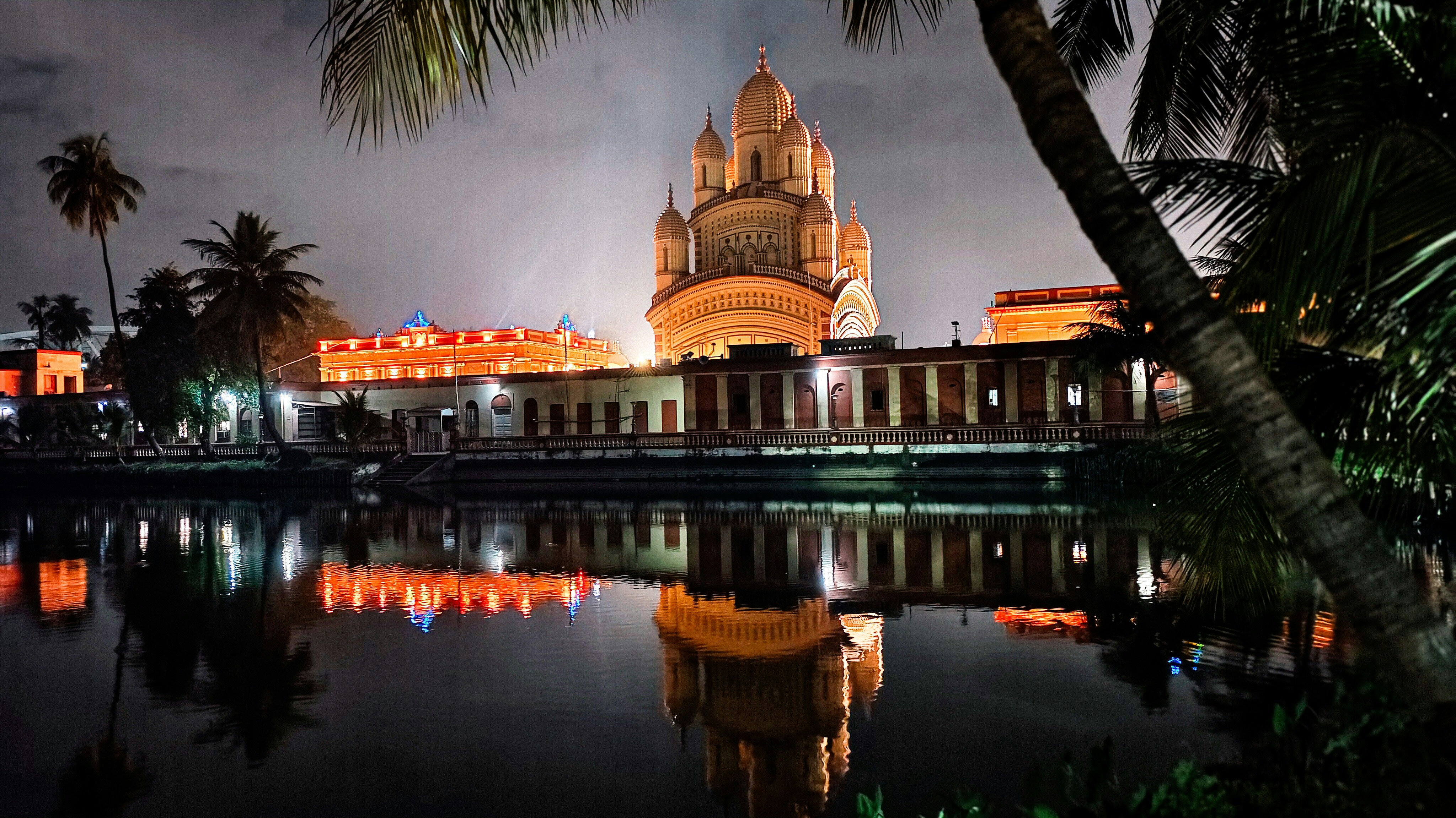A large building sitting next to a body of water