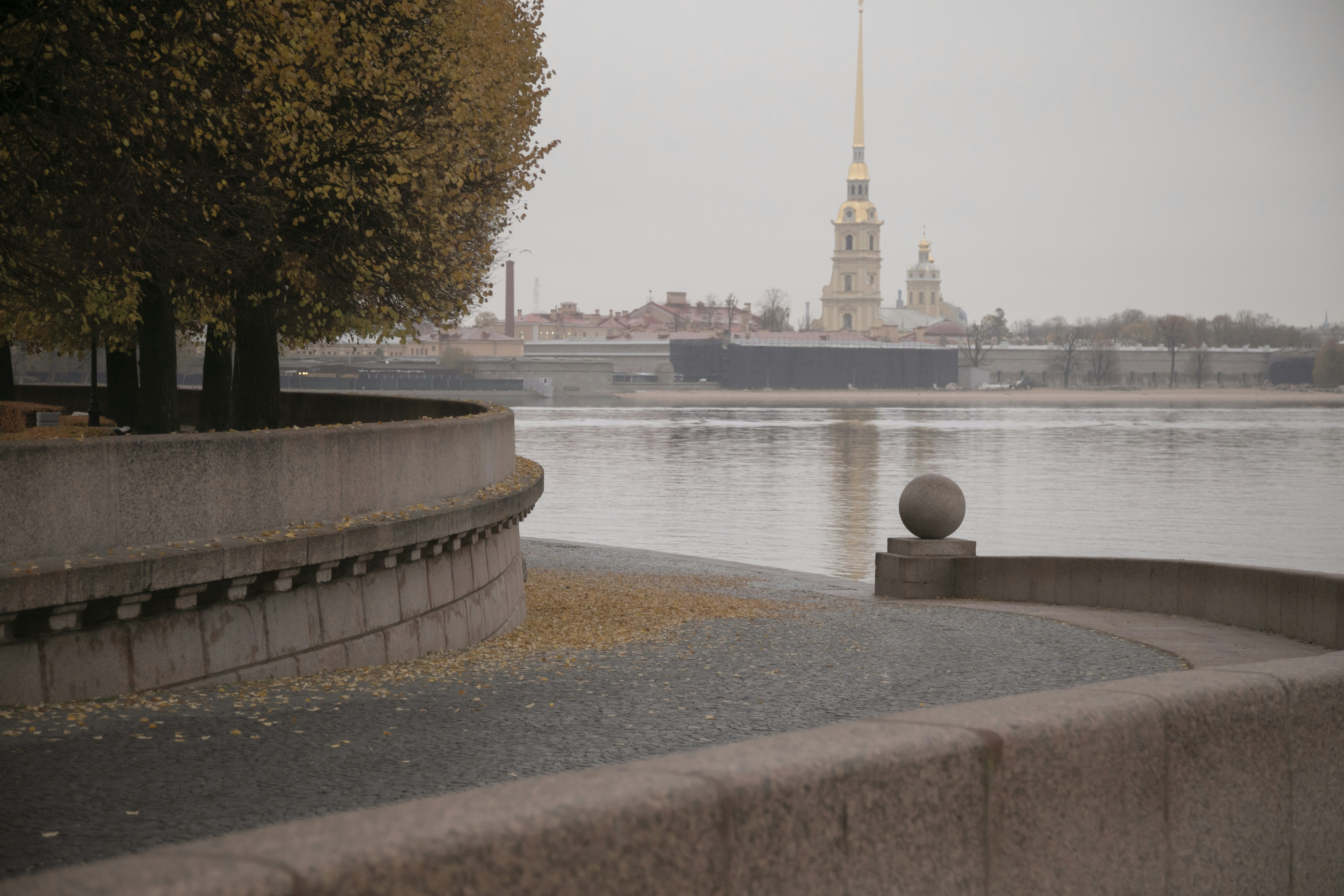 A large body of water with a clock tower in the background